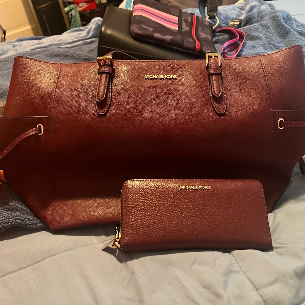 Red Michael Kors purse and wallet